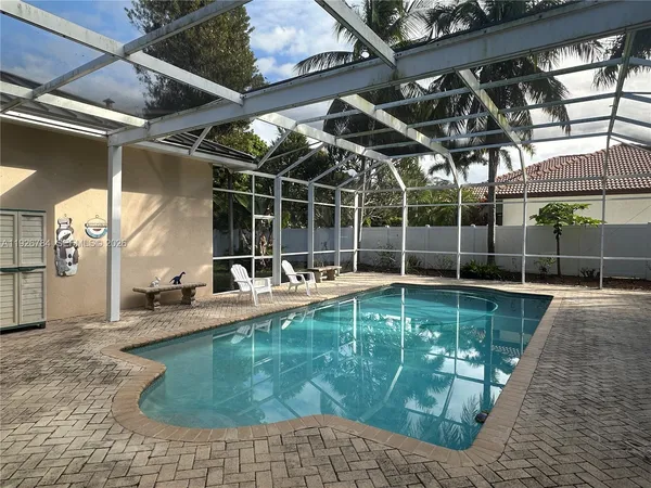 a view of a swimming pool with a patio