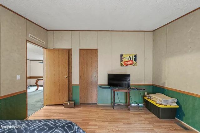 a view of a big yard with large trees