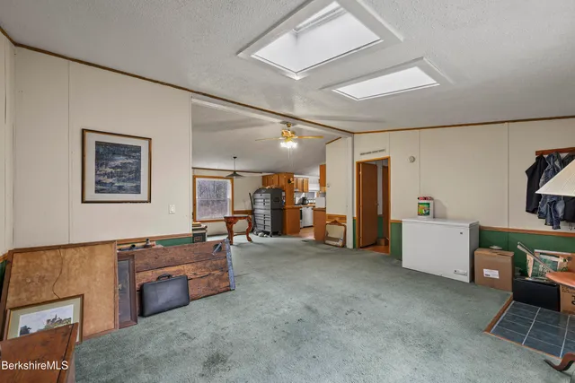 a view of a livingroom with furniture and windows