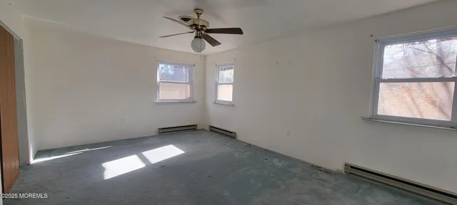 a view of empty room with windows