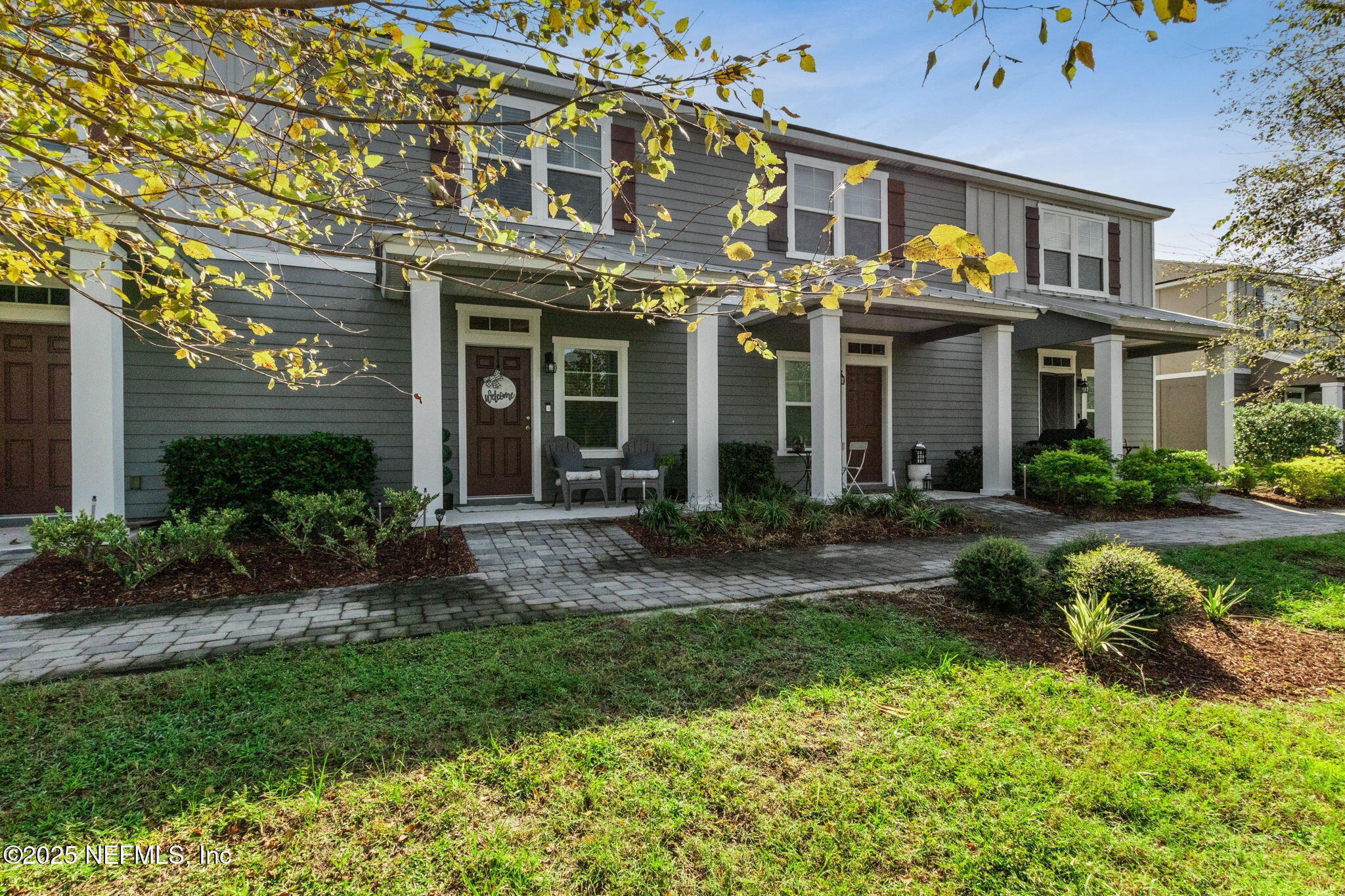 86440 Mainline Road Yulee, FL 32097 - Photo 2 of 36 a view of a brick building next to a yard