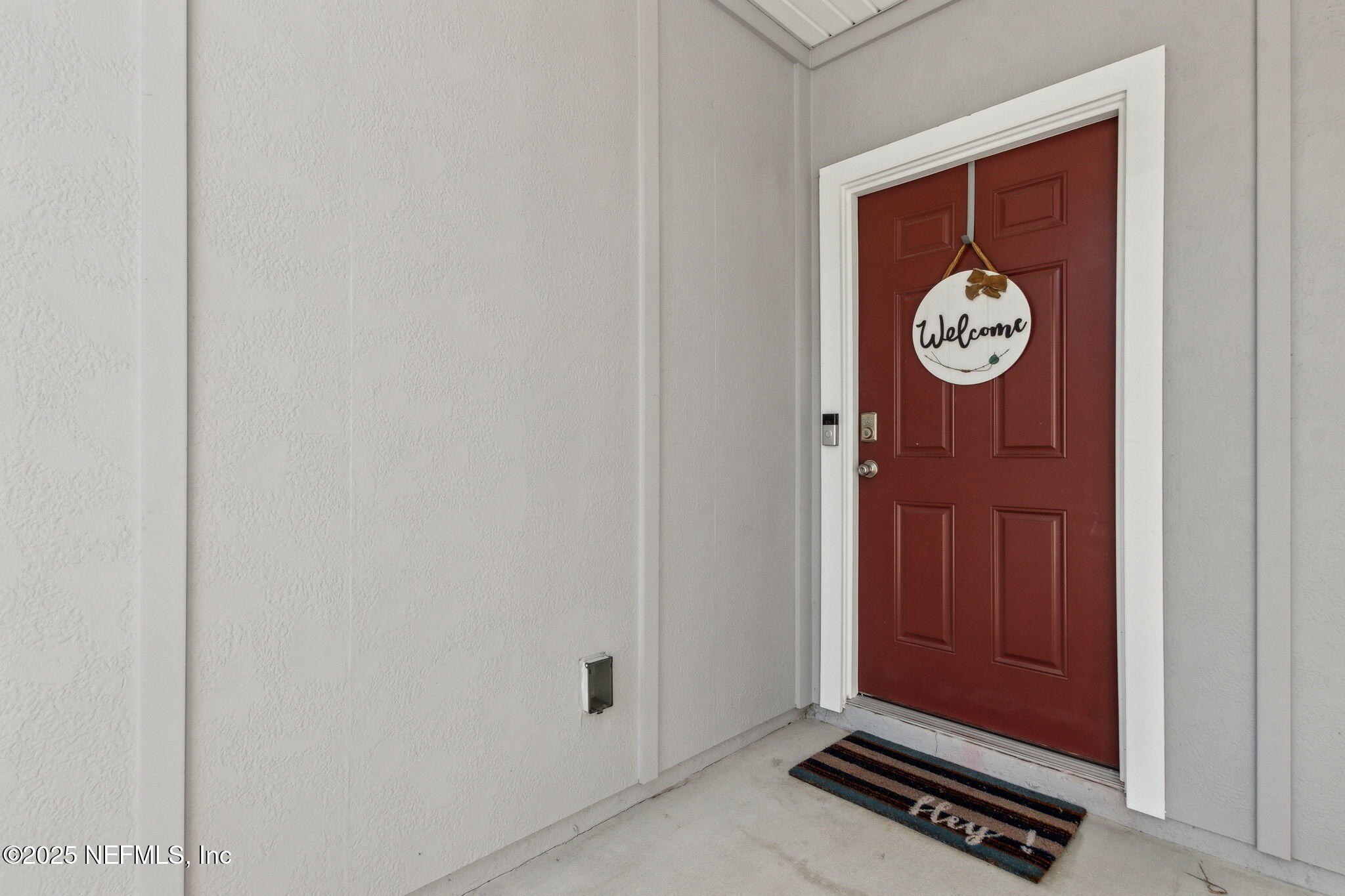 86440 Mainline Road Yulee, FL 32097 - Photo 23 of 36 a view of an entryway with a bench