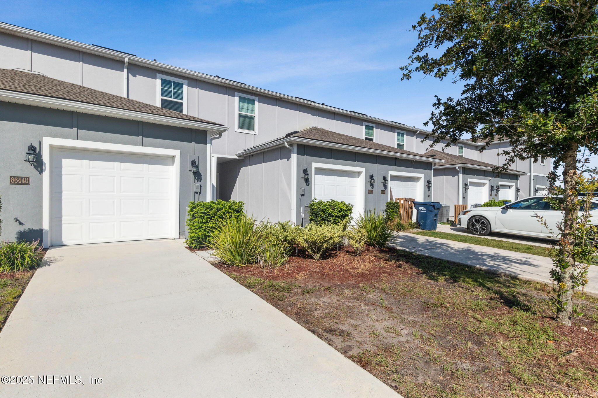 86440 Mainline Road Yulee, FL 32097 - Photo 25 of 36 a front view of a house with a yard