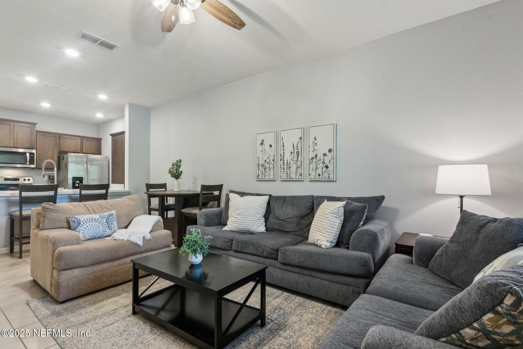 86440 Mainline Road Yulee, FL 32097 - Photo 6 of 36 a living room with furniture and a view of kitchen