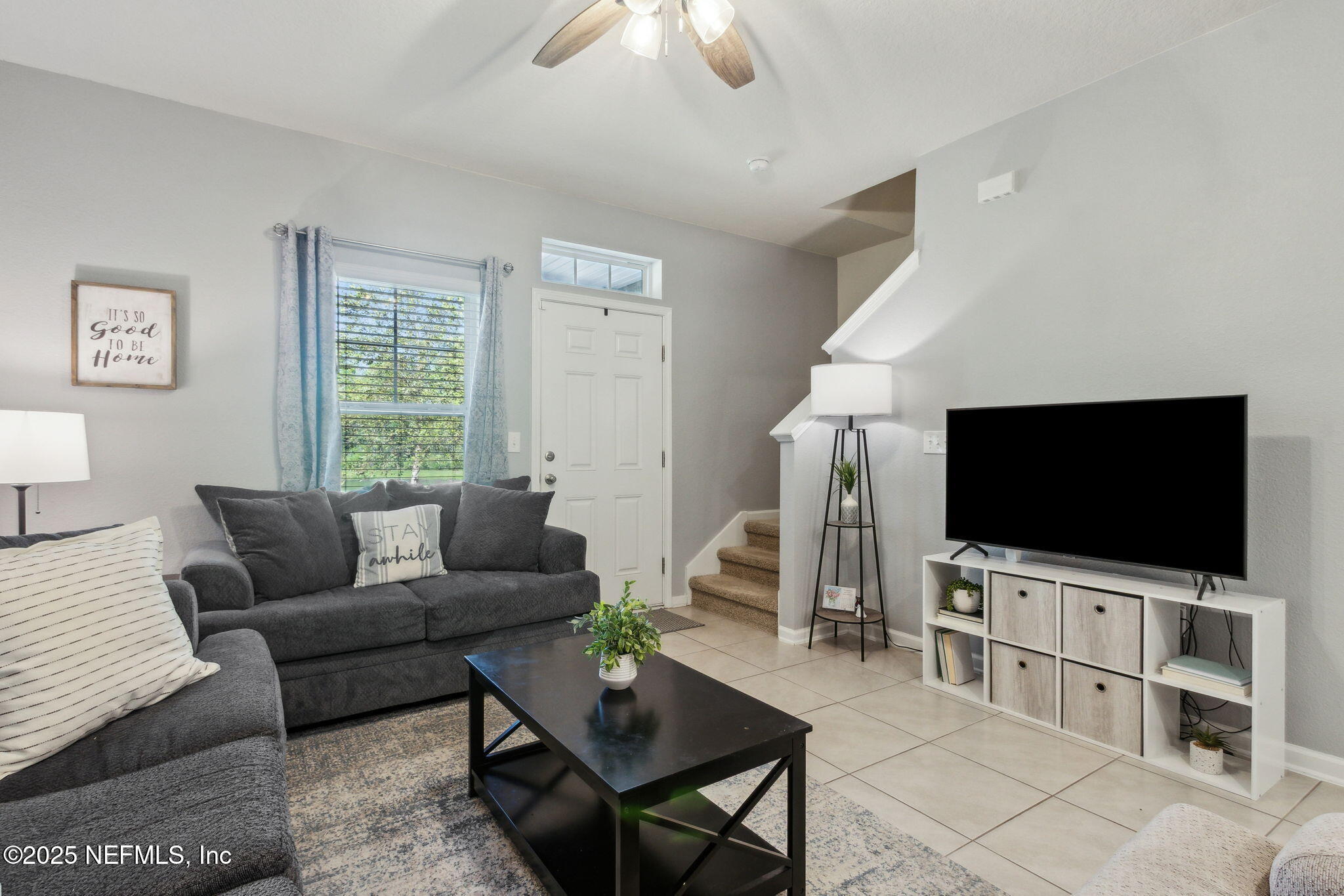 86440 Mainline Road Yulee, FL 32097 - Photo 8 of 36 a living room with furniture and a flat screen tv