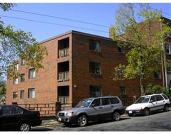 a view of a car parked in front of a house