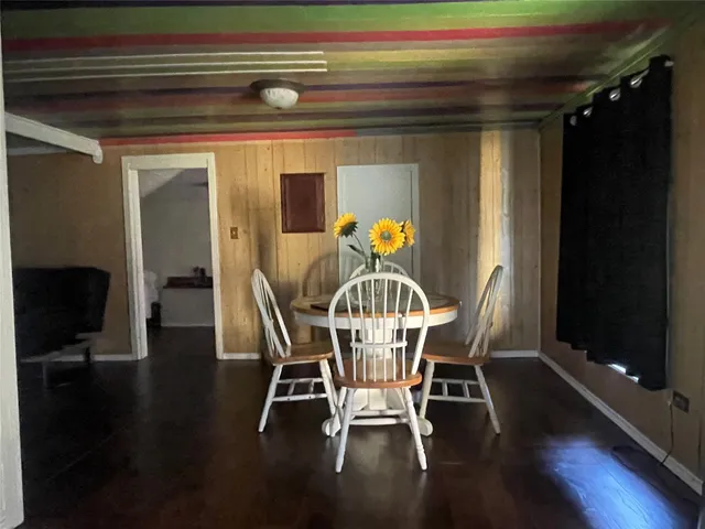 a bathroom with a toilet a sink and a window