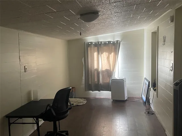 a kitchen with stainless steel appliances granite countertop a refrigerator a stove a sink and a window