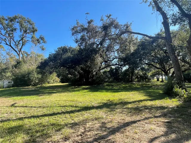 a view of a lake with a yard