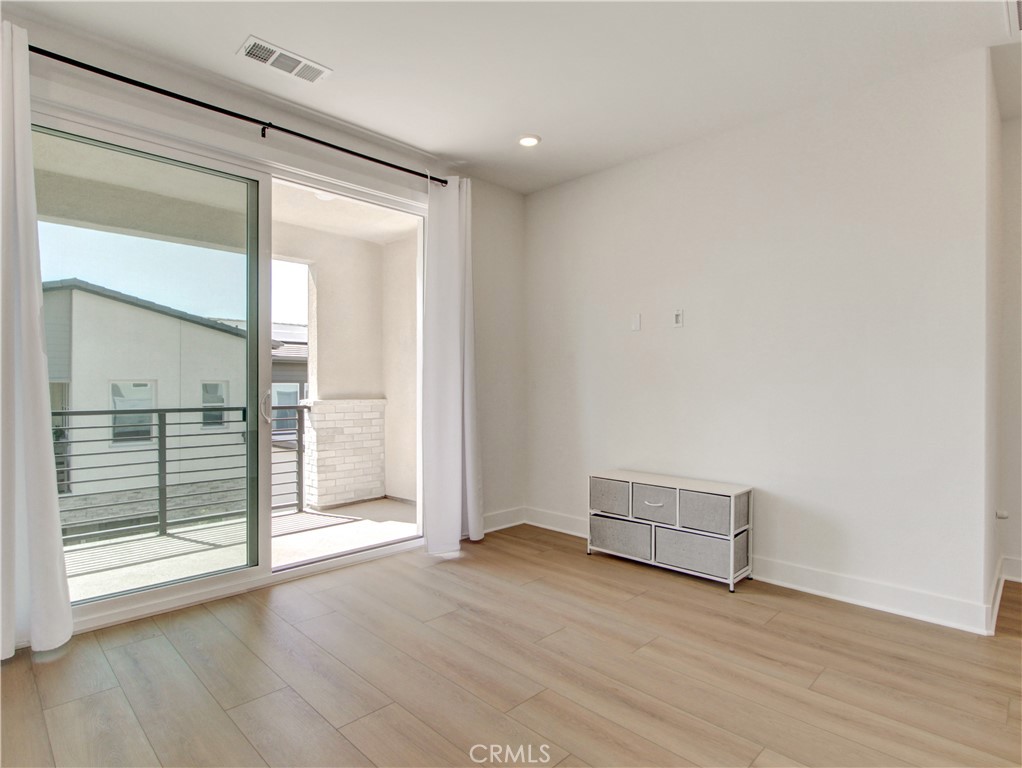 230 Sora Irvine, CA 92618 - Photo 19 of 52 an empty room with wooden floor and windows
