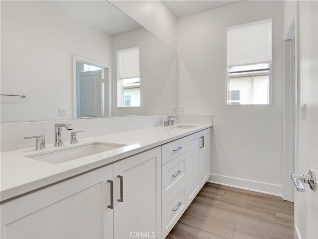 230 Sora Irvine, CA 92618 - Photo 27 of 52 a bathroom with 2 sink tub and a mirror