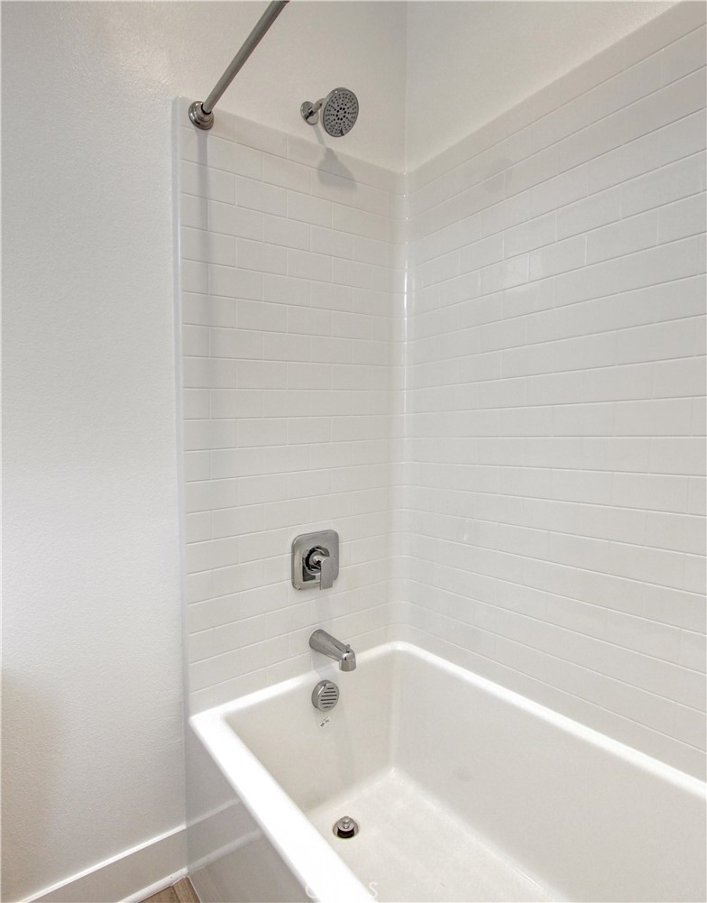 230 Sora Irvine, CA 92618 - Photo 28 of 52 a white bath tub sitting next to a white sink and vanity