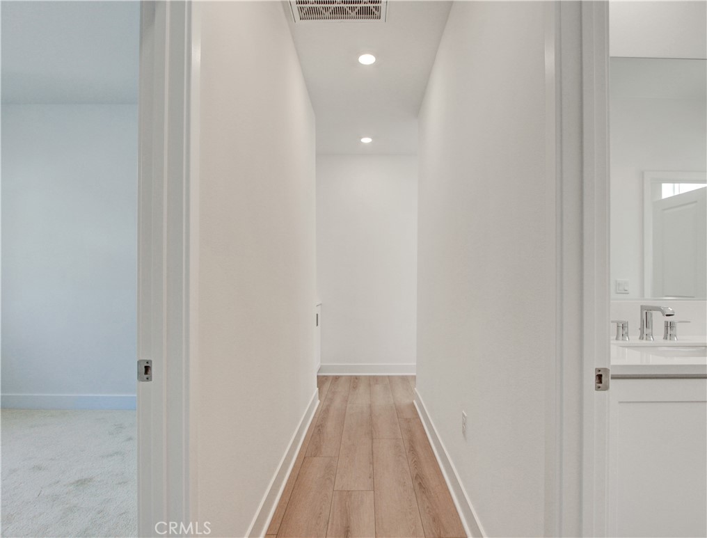 230 Sora Irvine, CA 92618 - Photo 35 of 52 a view of a hallway with wooden floor and closet