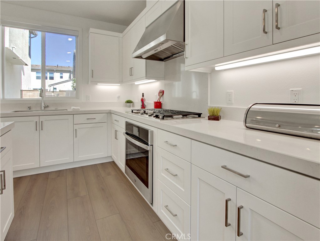 230 Sora Irvine, CA 92618 - Photo 6 of 52 a kitchen with cabinets a sink and appliances