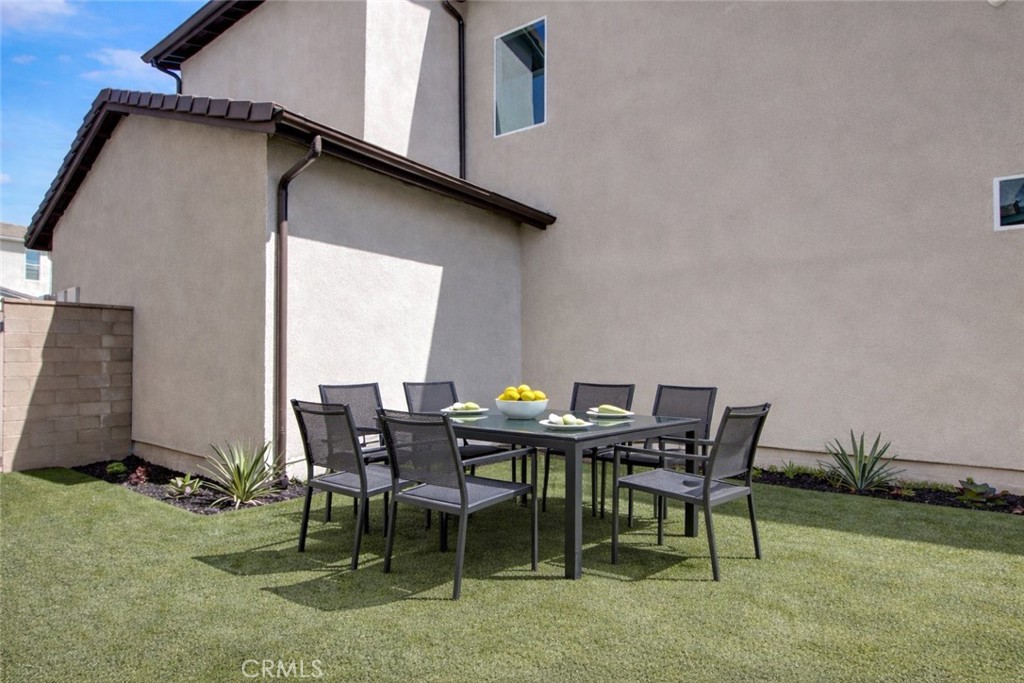 230 Sora Irvine, CA 92618 - Photo 7 of 52 a patio with table and chairs