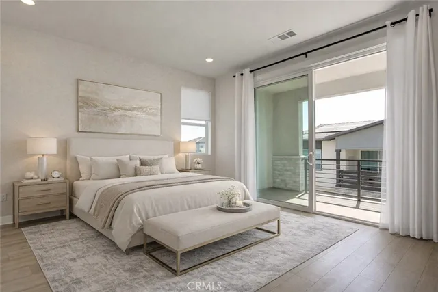 a spacious bedroom with a bed and a walk in closet