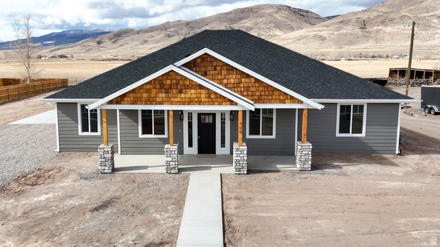 408 South Center Street Elsinore, UT 84724 - Photo 1 of 1 Craftsman-style house featuring roof with shingles, a mountain view, and a porch
