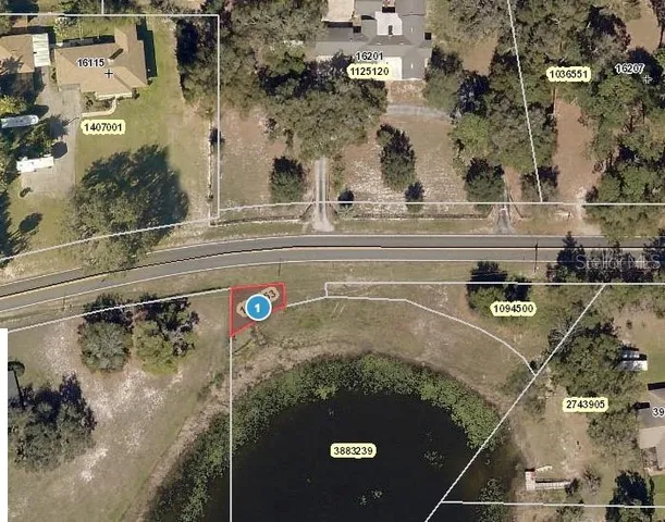 an aerial view of a residential houses with outdoor space