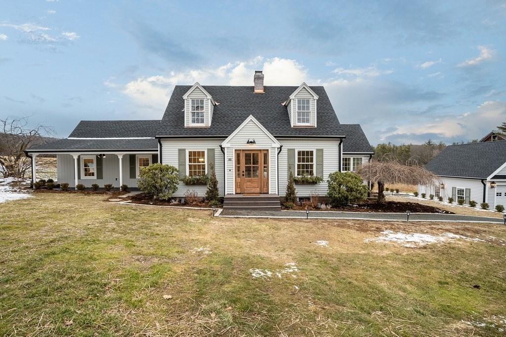 1051 Chesterfield Road Northampton, MA 01062 - Photo 1 of 42 a front view of a house with a garden