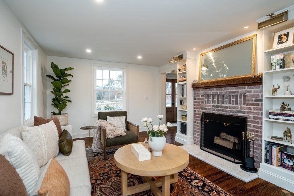 1051 Chesterfield Road Northampton, MA 01062 - Photo 12 of 42 a living room with furniture a fireplace and a large window