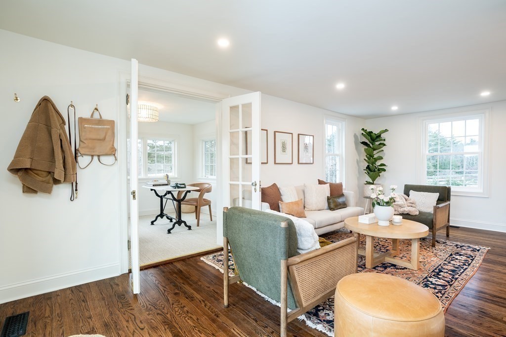 1051 Chesterfield Road Northampton, MA 01062 - Photo 13 of 42 a living room with furniture a dining table and a wooden floor
