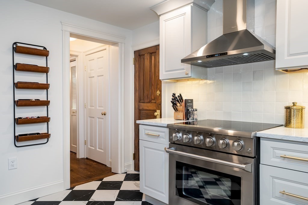 1051 Chesterfield Road Northampton, MA 01062 - Photo 17 of 42 a kitchen with stainless steel appliances granite countertop a stove and a refrigerator