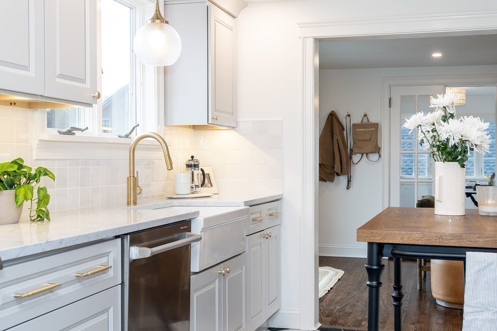 1051 Chesterfield Road Northampton, MA 01062 - Photo 20 of 42 a kitchen with stainless steel appliances a sink cabinets and wooden floor