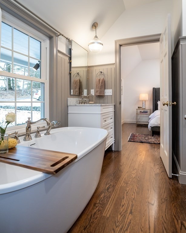 1051 Chesterfield Road Northampton, MA 01062 - Photo 30 of 42 a view of a living room and kitchen with a large window