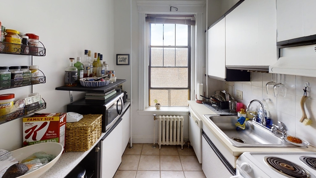 6 Sutherland Road, Unit 41 Boston, MA 02135 - Photo 3 of 9 a kitchen that has a sink and a stove