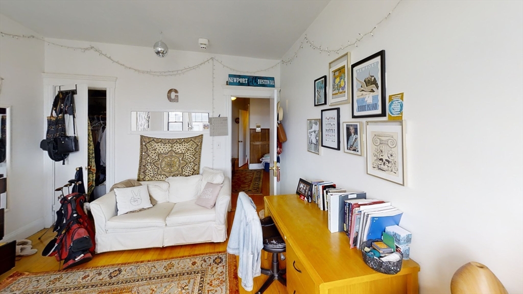 6 Sutherland Road, Unit 41 Boston, MA 02135 - Photo 6 of 9 a living room with furniture and a couch