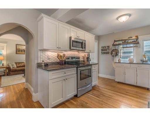 59 R Pilgrim Road Marblehead, MA 01945 - Photo 10 of 21 a kitchen with stainless steel appliances granite countertop a stove a sink and a microwave