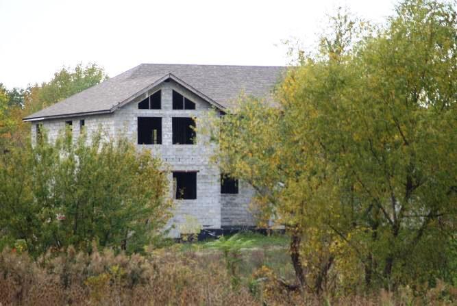 22844 Miller Road Steger, IL 60475 - Photo 1 of 10 a front view of a house with plants and garden
