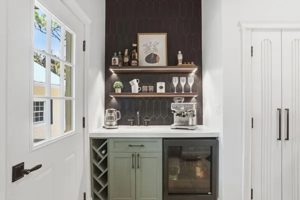 a bedroom with a bed and a chair