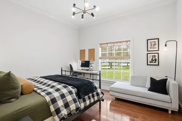 a view of a house with backyard sitting area and garden