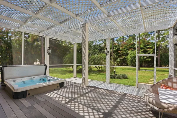 a view of house with backyard and a garden