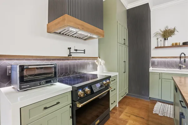 a kitchen with a stove and a microwave