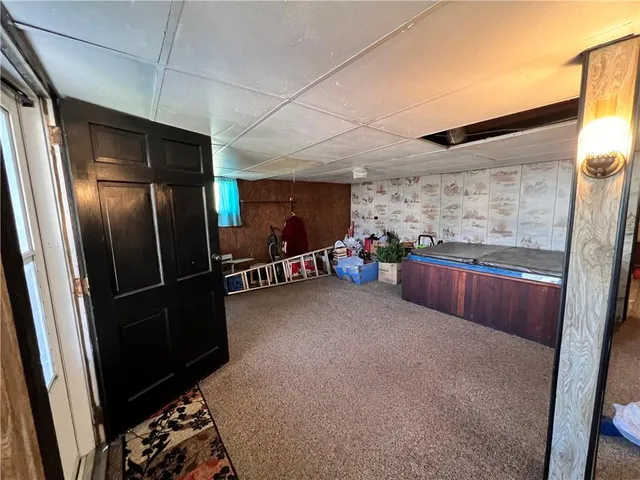a kitchen with granite countertop a refrigerator and a sink