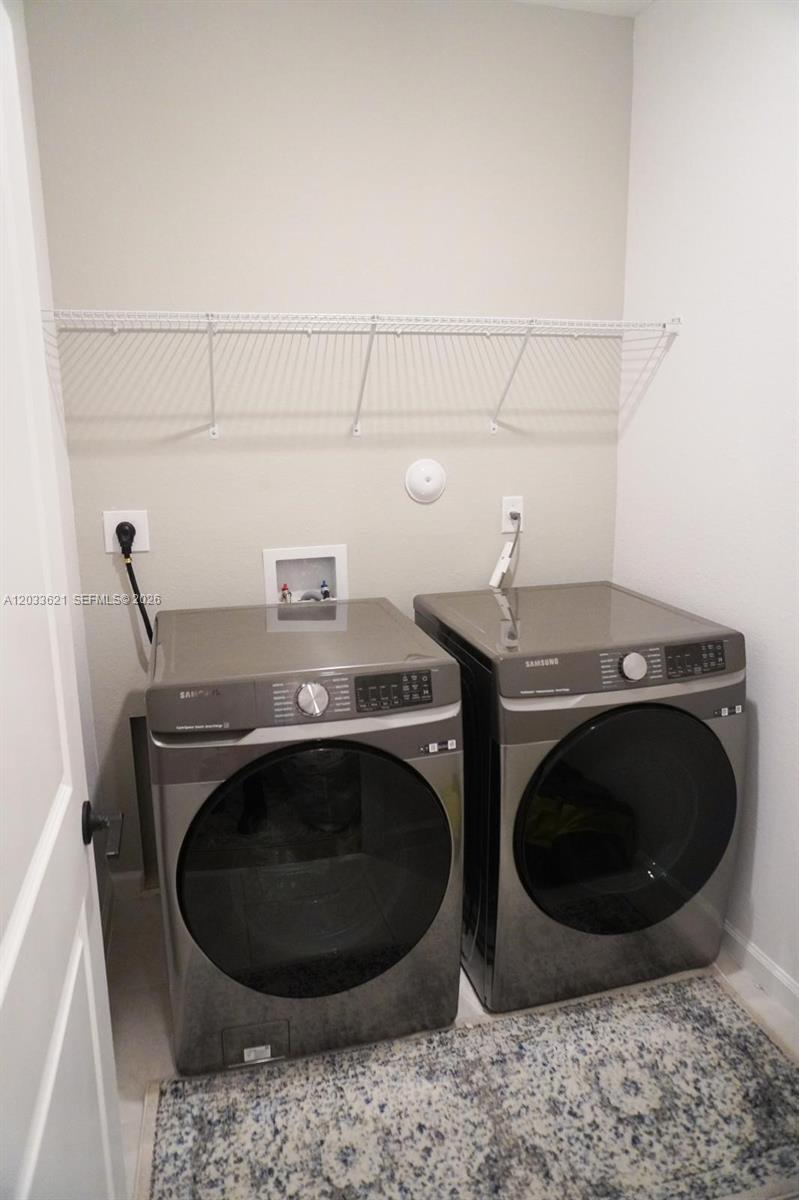 11942 Southwest 243rd Street Homestead, FL 33032 - Photo 33 of 50 a close up view of washer and dryer