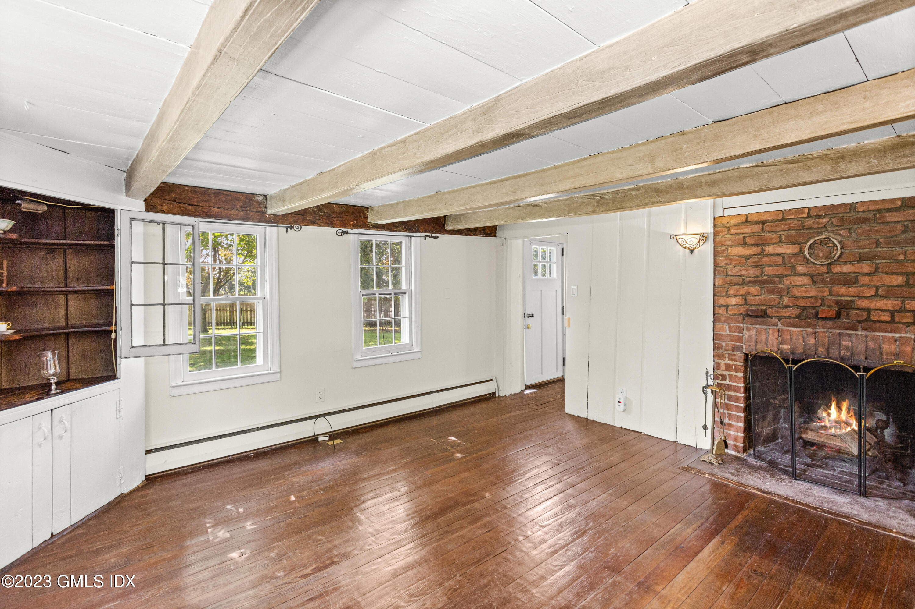 1 Cary Road Riverside, CT 06878 - Photo 4 of 15 a view of an empty room with wooden floor and a window