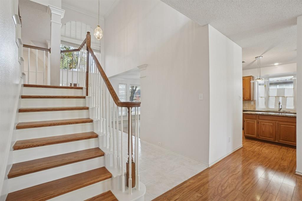3110 Andrew Lane Carrollton, TX 75007 - Photo 15 of 36 a view of entryway and hall with wooden floor