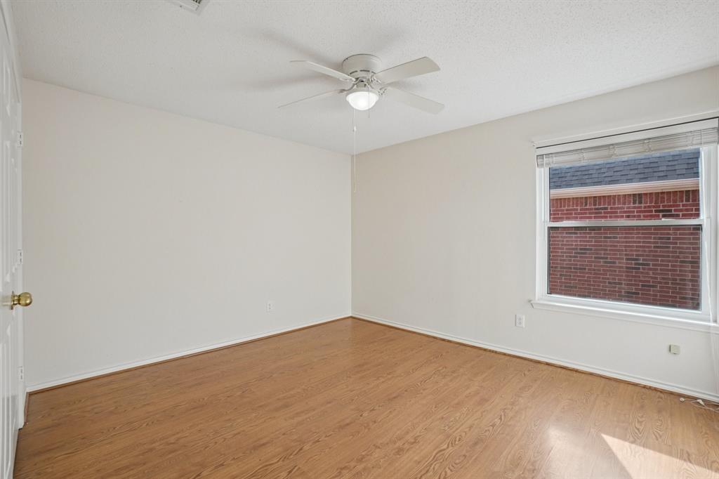 3110 Andrew Lane Carrollton, TX 75007 - Photo 18 of 36 an empty room with a window and a ceiling fan