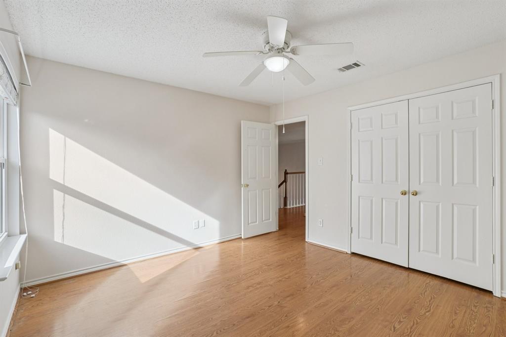 3110 Andrew Lane Carrollton, TX 75007 - Photo 19 of 36 a view of an empty room with a ceiling fan