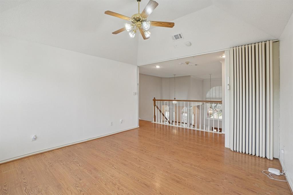 3110 Andrew Lane Carrollton, TX 75007 - Photo 22 of 36 an empty room with windows and fan