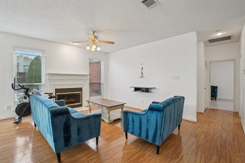 3110 Andrew Lane Carrollton, TX 75007 - Photo 6 of 36 a living room with furniture and a fireplace