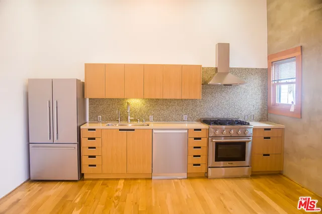a kitchen with a stove and a sink