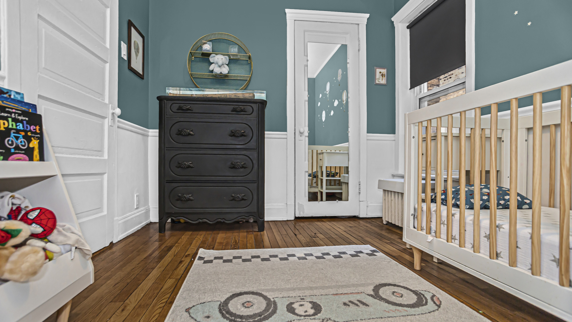 322 Main Street, Unit 2 Evanston, IL 60202 - Photo 13 of 15 a view of a bedroom with baby crib and toys