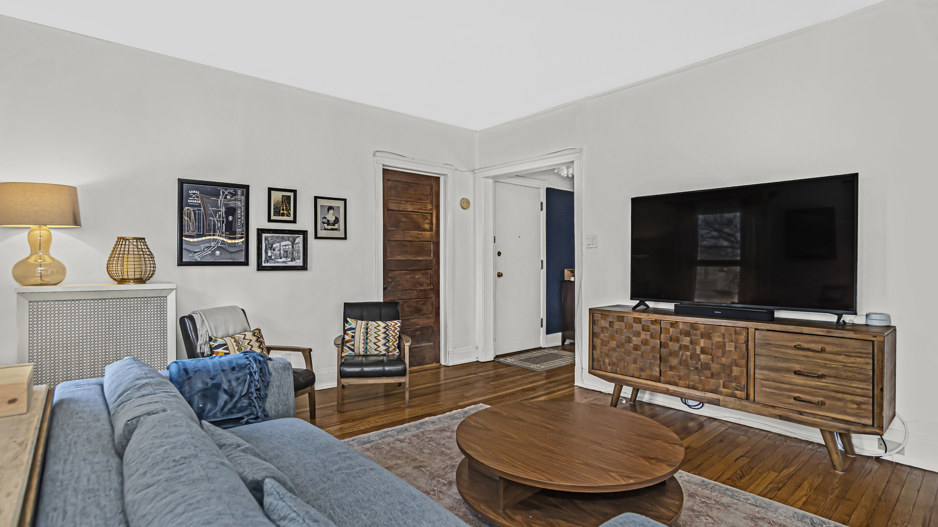 322 Main Street, Unit 2 Evanston, IL 60202 - Photo 3 of 15 a living room with furniture and a flat screen tv