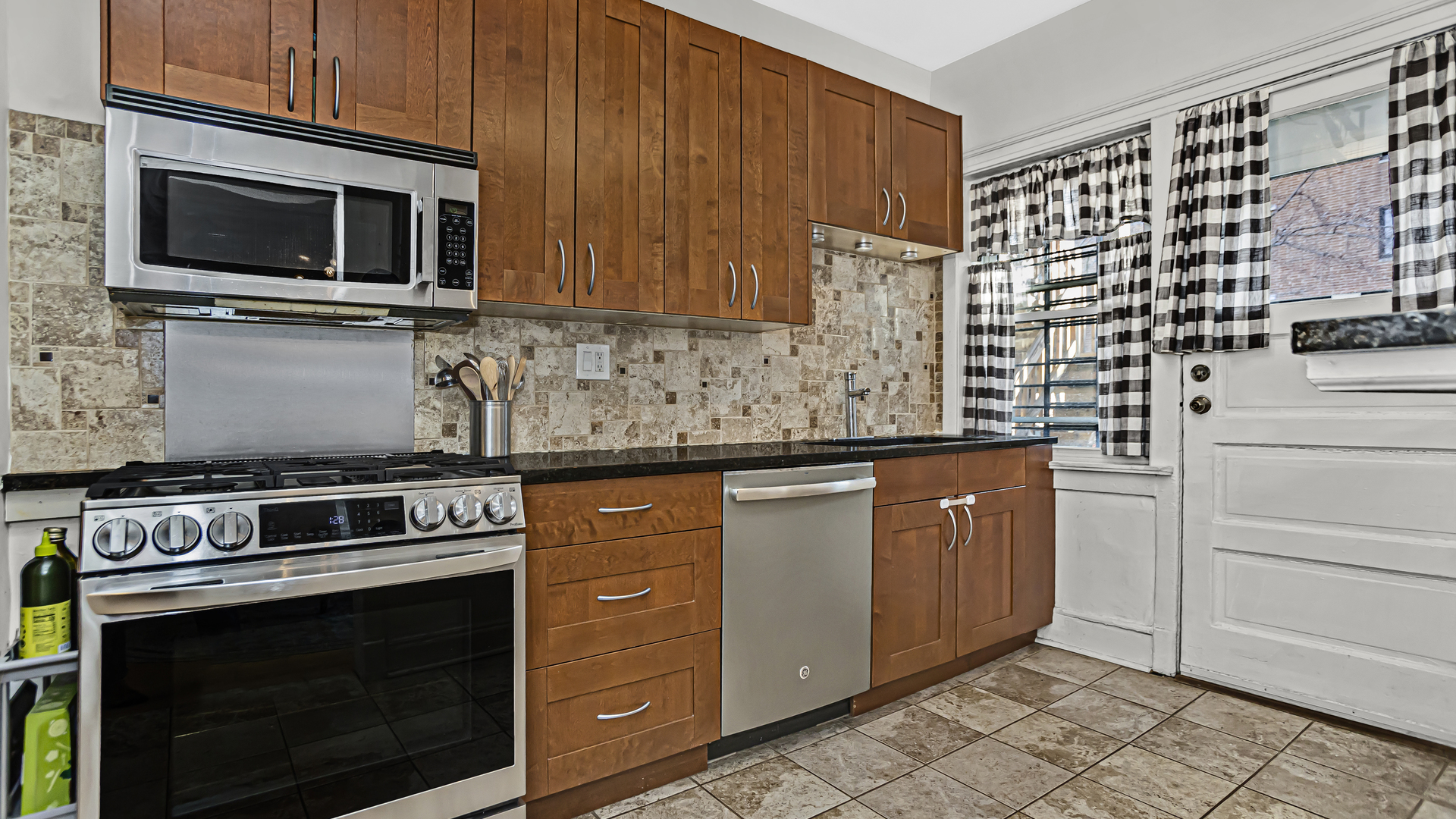 322 Main Street, Unit 2 Evanston, IL 60202 - Photo 4 of 15 a kitchen with granite countertop cabinets stainless steel appliances and a counter space