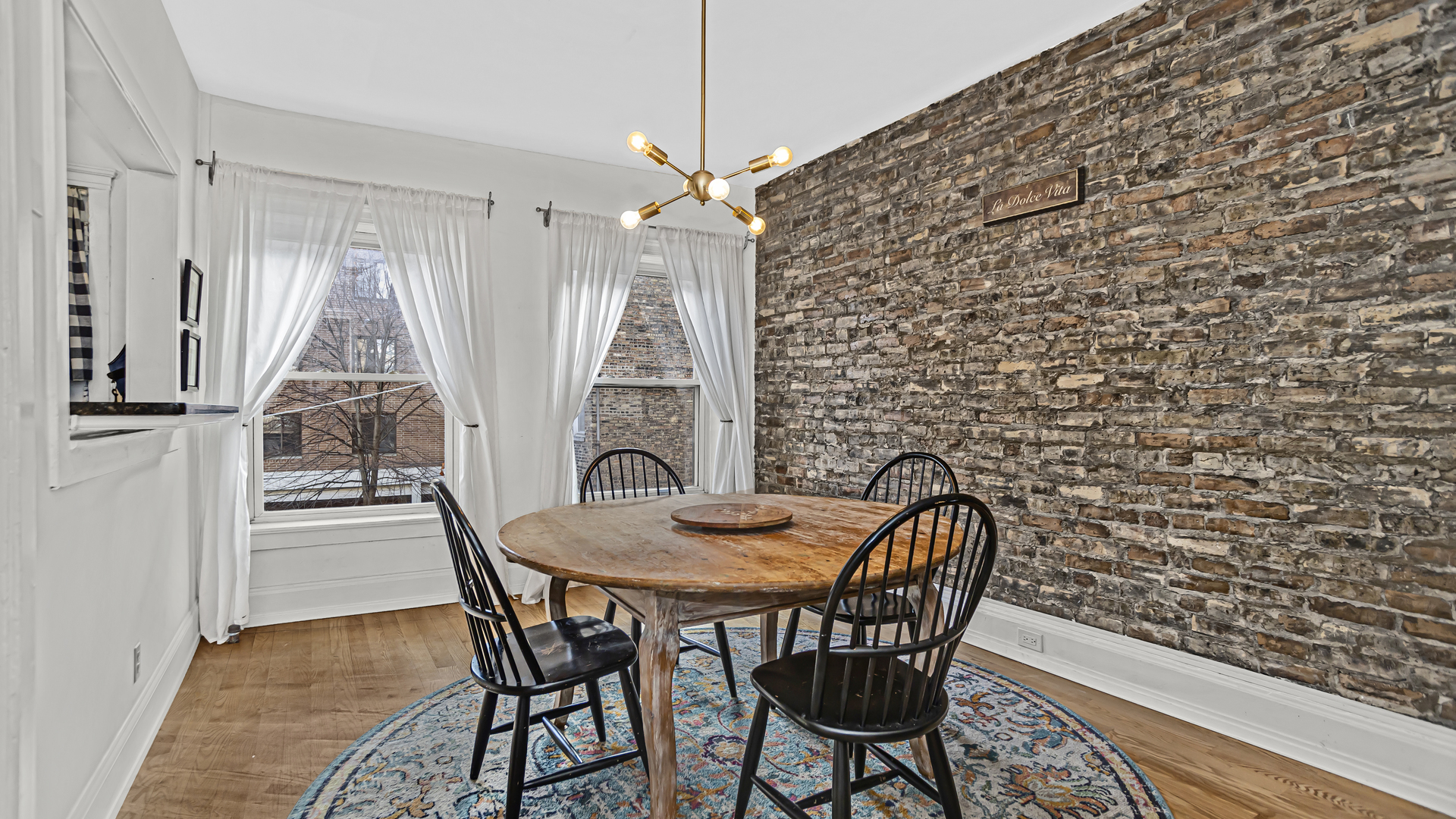 322 Main Street, Unit 2 Evanston, IL 60202 - Photo 7 of 15 a view of a dining room with furniture and wooden floor