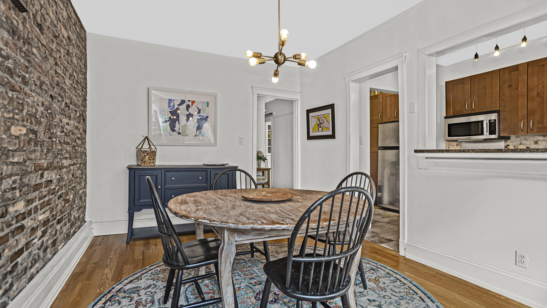 322 Main Street, Unit 2 Evanston, IL 60202 - Photo 8 of 15 a view of a dining room with furniture and wooden floor